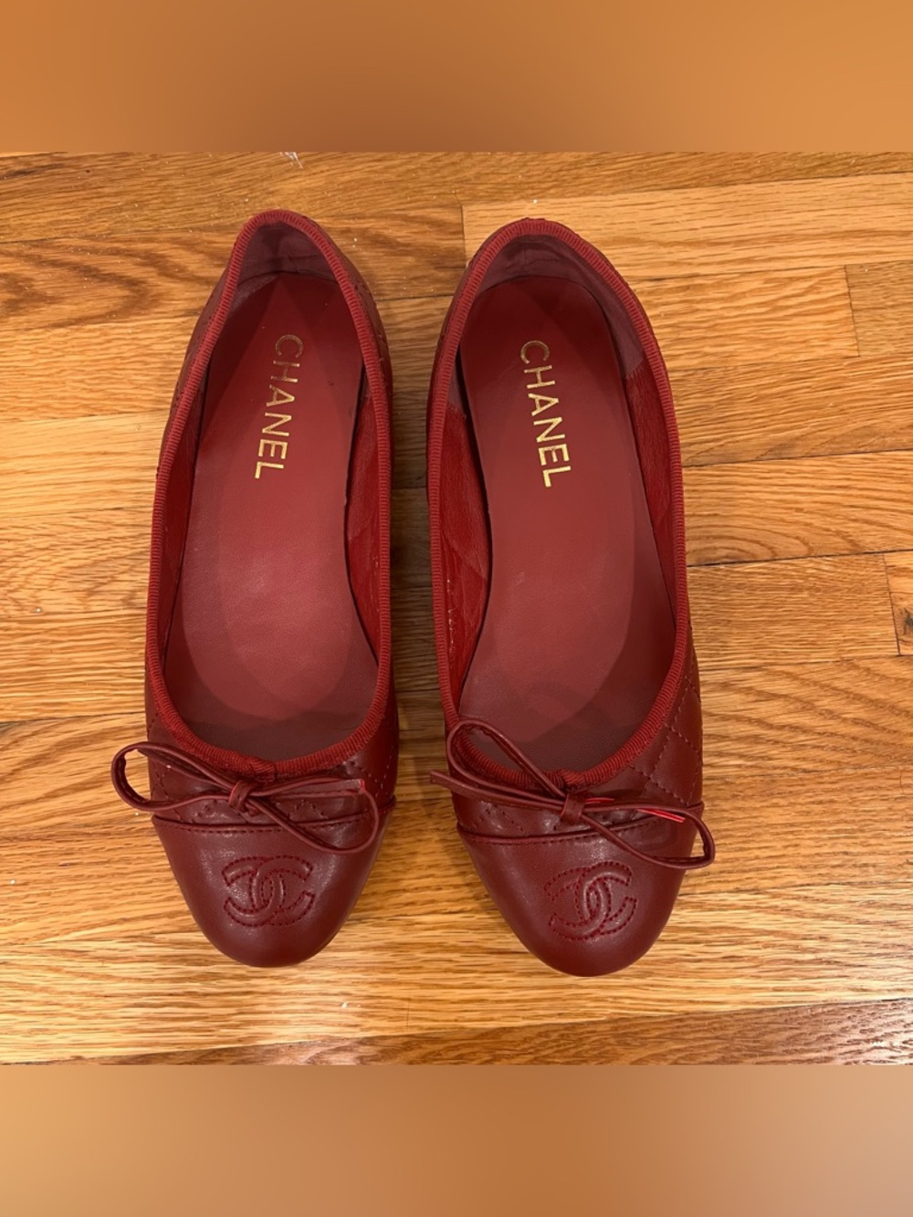 Burgundy red quilted ballet flats with bows